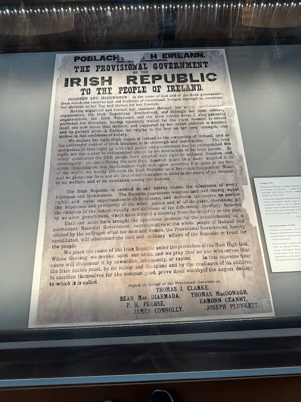 Glass-covered display of the 1916 Proclamation of the Irish Republic, a historic printed document addressed to the people of Ireland, declaring independence and signed by seven leaders of the Easter Rising.