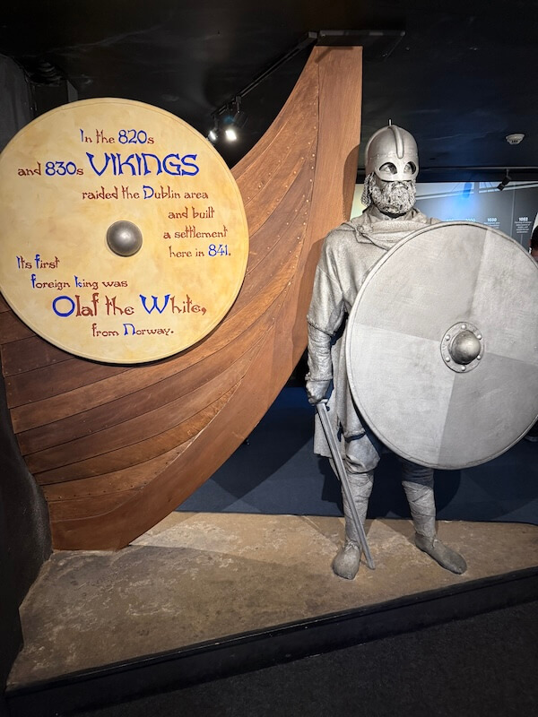 Features a Viking figure beside a large wooden shield explaining Viking raids on Dublin and mentioning Olaf the White.