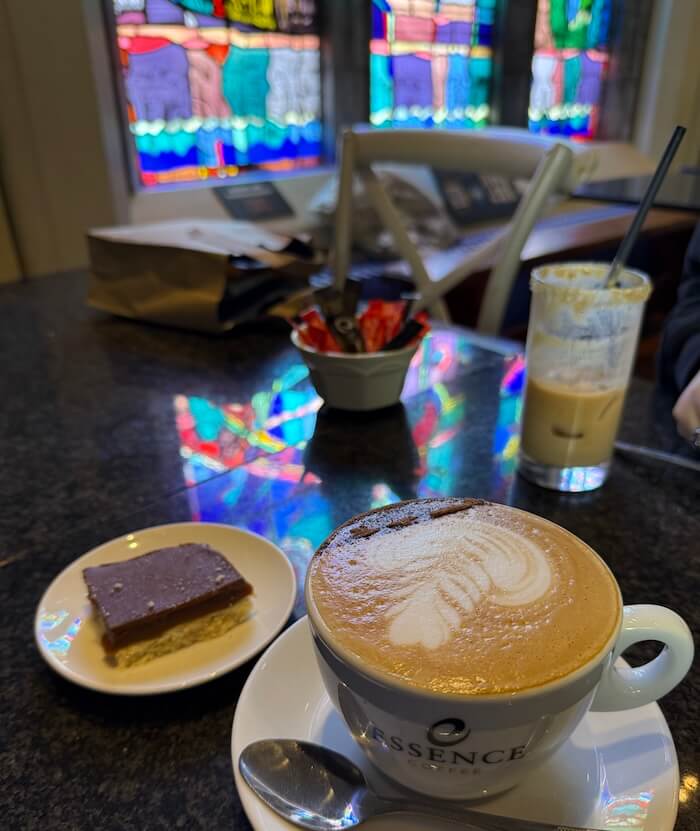 Café within Dublinia, featuring stained-glass windows and a cosy setup for refreshments.