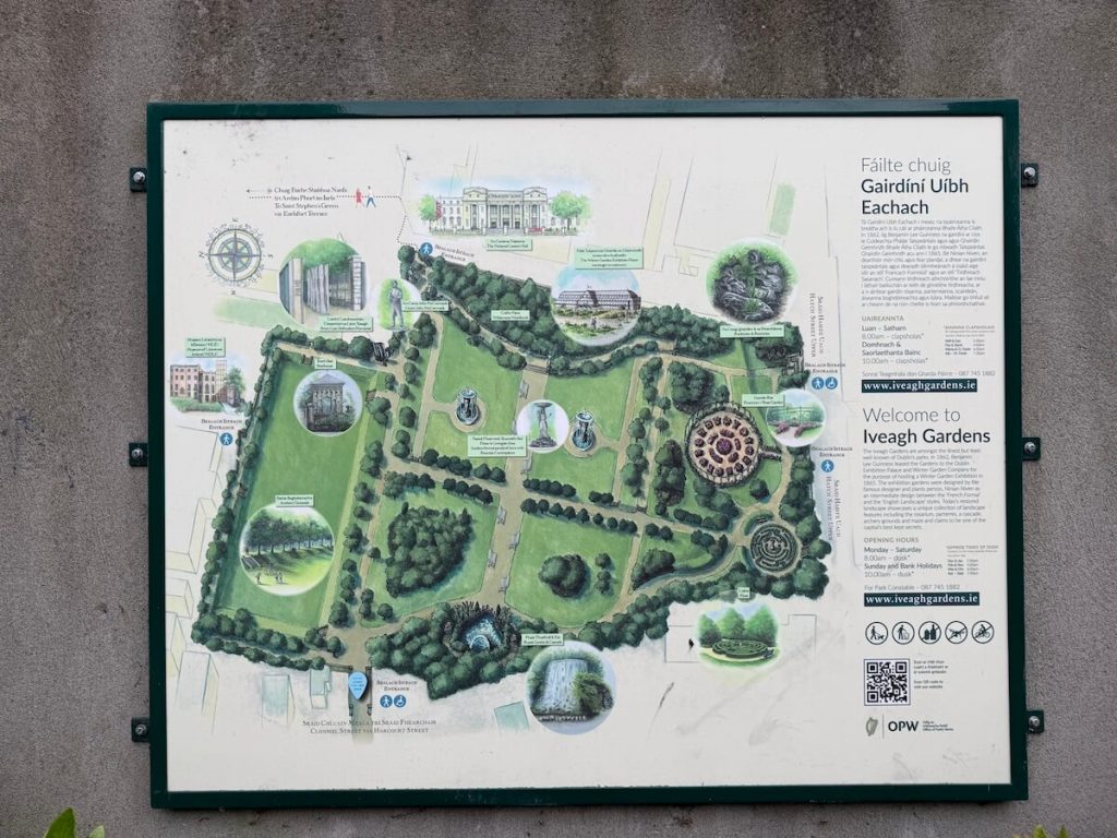 llustrated map and welcome sign for Iveagh Gardens, showing key attractions like the waterfall, maze, and fountains, with visitor information in both Irish and English.
